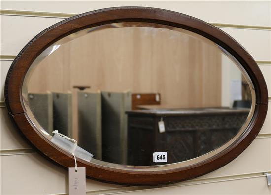 A walnut and glass mirror W.67cm
